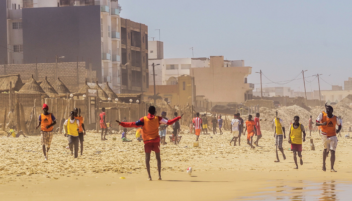Soccer players at the Plage de Yoff, a beach south of Dakar