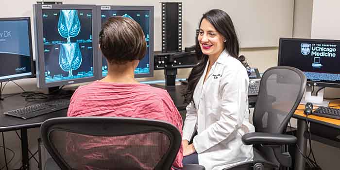 A patient and radiologist discuss breast imaging