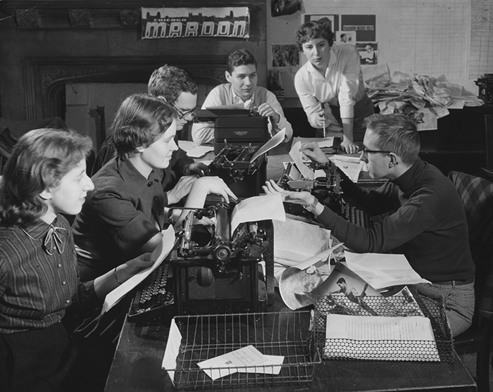 Several members of the Chicago Maroon editorial staff sitting around a table in 1956 