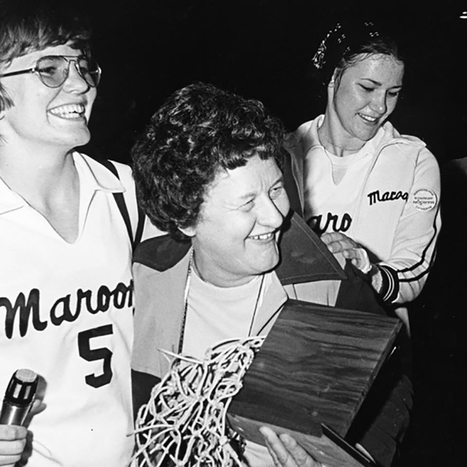 Patrica Kirby with 1976 basketball team cocaptains