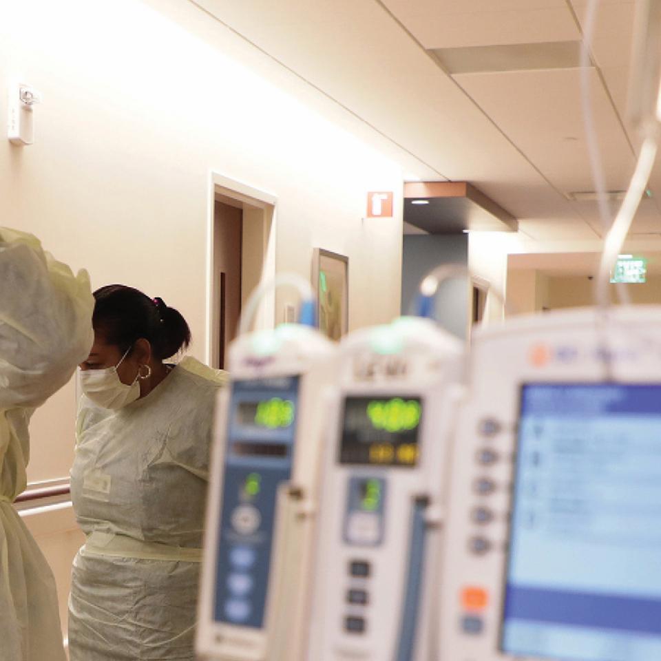 nurses wearing PPE in a hospital