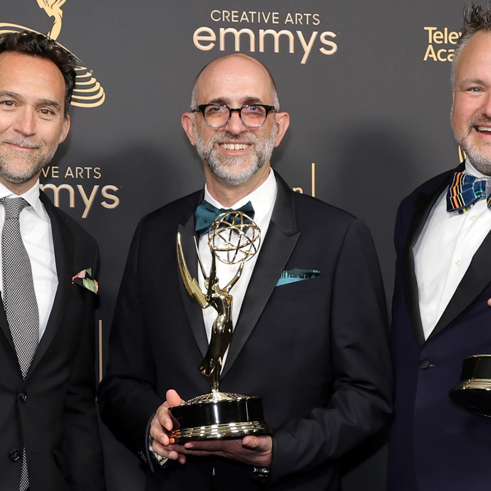 Production designer Curt Beech, art director Jordan Jacobs, and Rich Murray, AB’94, with their Emmys for Only Murders in the Building.