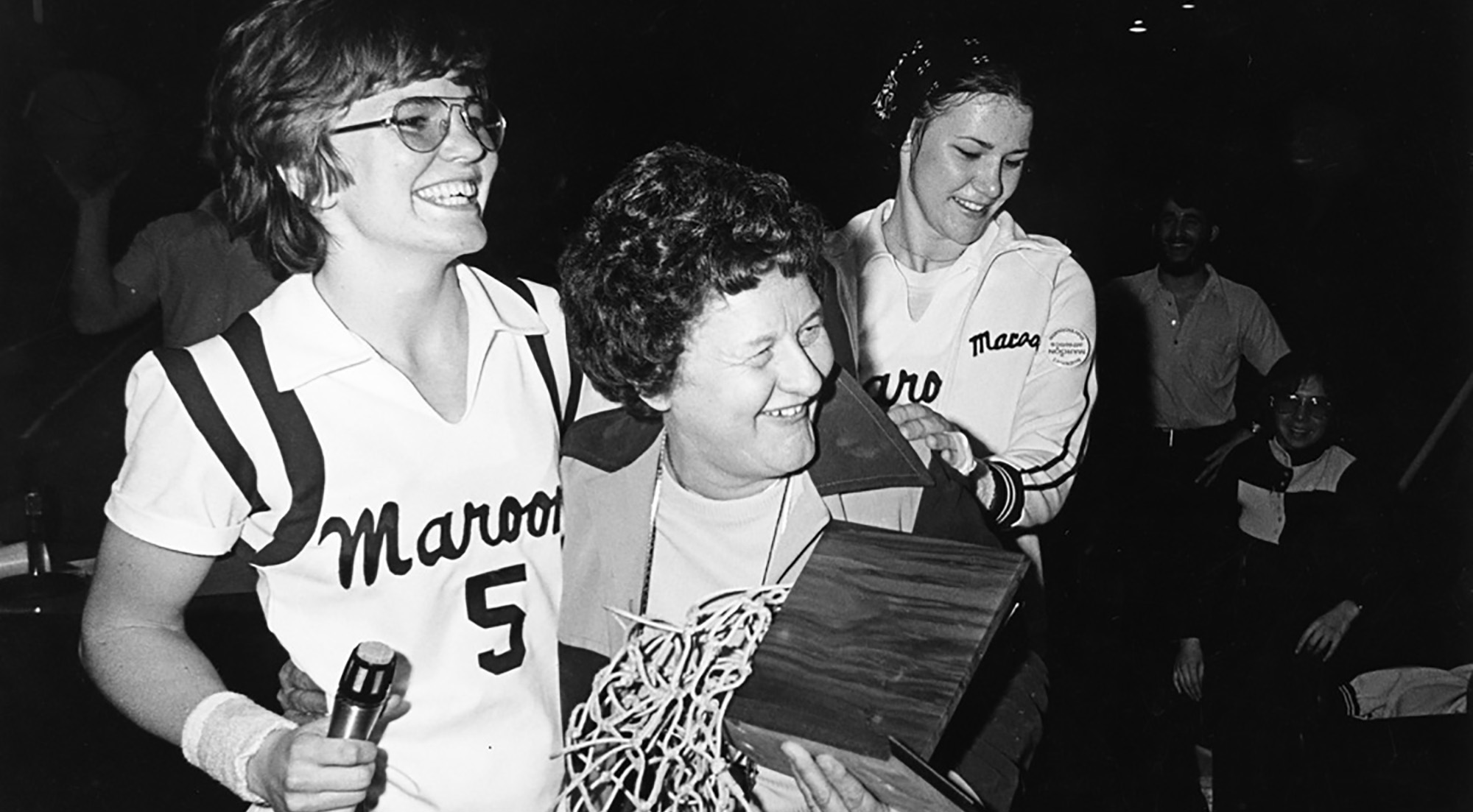 Patrica Kirby with 1976 basketball team cocaptains