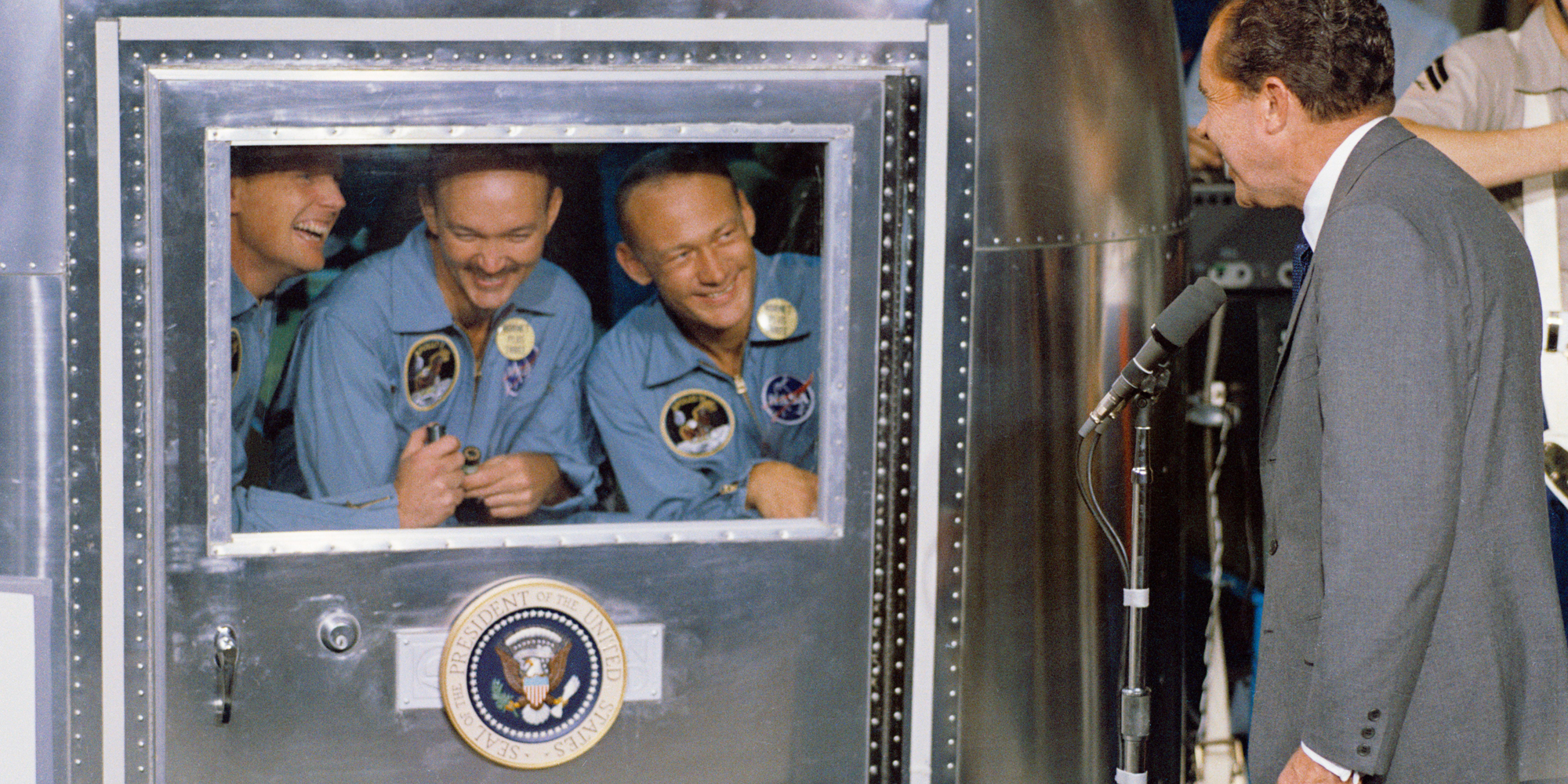 The Apollo 11 astronauts greet President Richard Nixon from quarantine