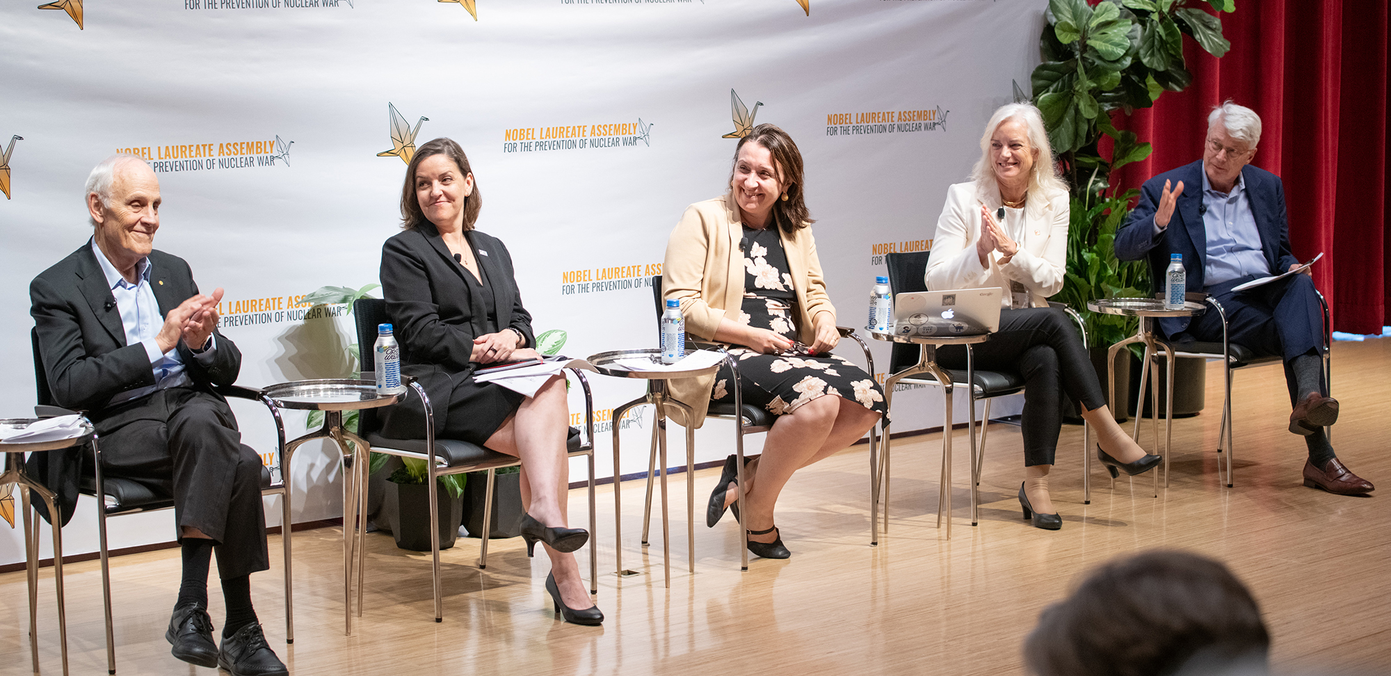 David Gross, Alexandra Bell, Francesca Giovannini, Karen Hallberg, and Brian Schmidt at the Nobel Laureate Assembly for the Prevention of Nuclear War.