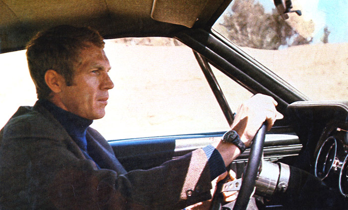 Steve McQueen driving his car in the film Bullitt