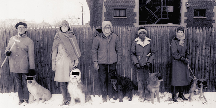 Chicago Journal staffers pose with their dogs in 1978