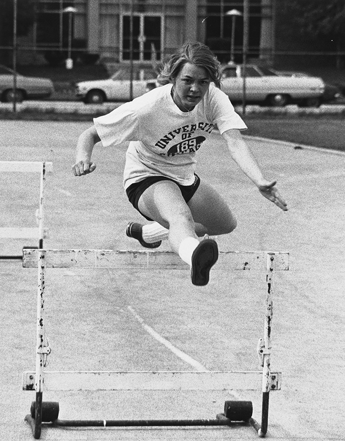 Becky Clouse running hurdles in the 1970s