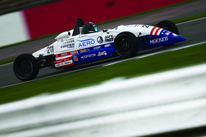 Andrew Castro behind the wheel of his race car