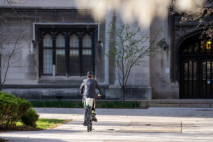 Jean Boyer riding his bike on the quad