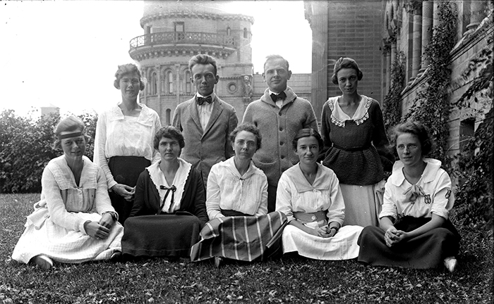 A group of staff members (7 women, 2 men) sitting outside at Yerkes Observatory in 1916