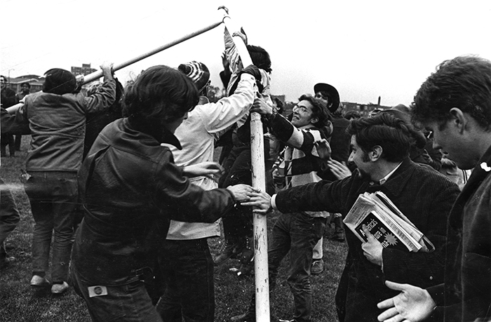 people tearing down the goalposts at a 1969 football game at UChicago 