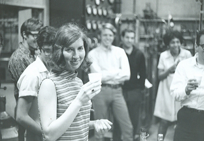 Sandra Greer toasting her successful dissertation defense in 1969