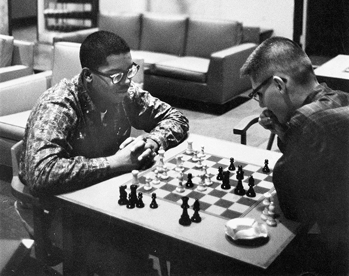 Students playing chess in a UChicago residence hall in 1960