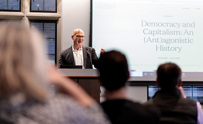 James Sparrow speaking at a lectern during the opening of a conference