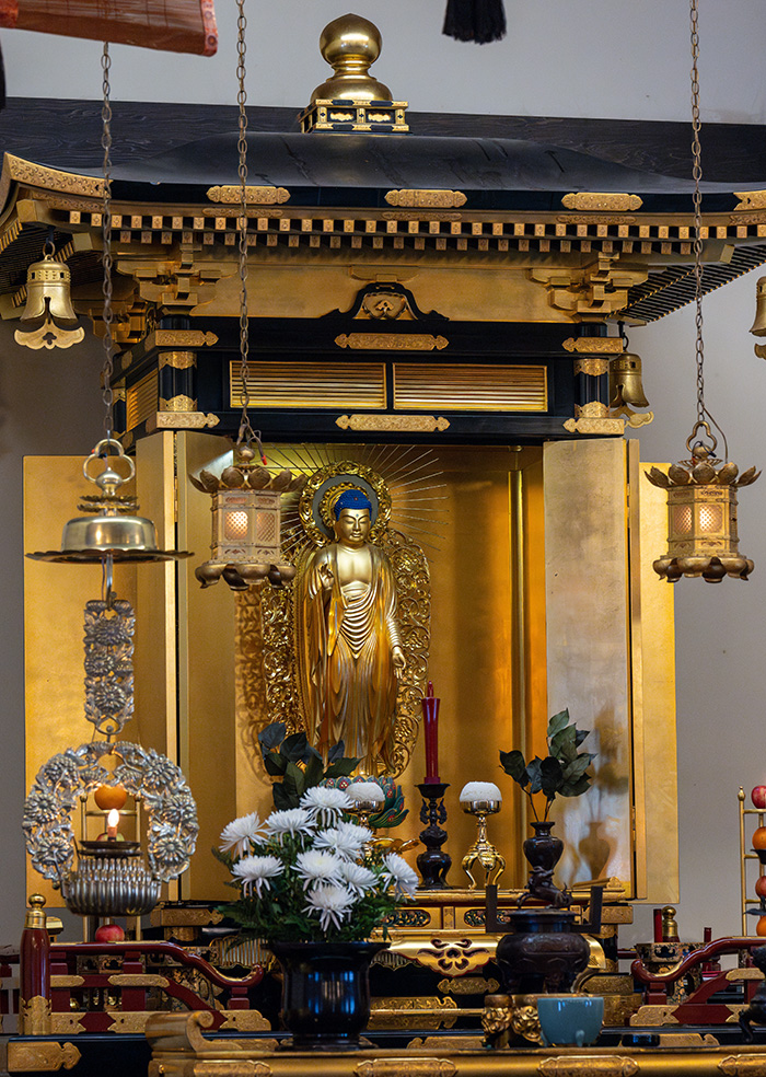 The figure of Amida Buddha occupies the central position of the Midwest Buddhist Temple’s altar. (Photography by Jason Smith)
