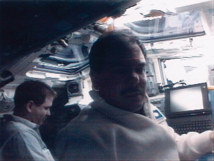 Two astronauts in a spaceship