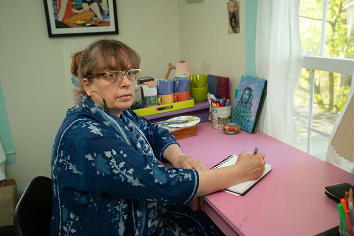 Daisy Rockwell at home at her desk