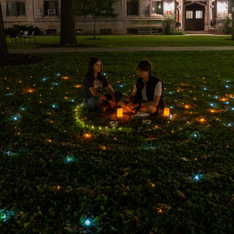Students participating in Late-Night Labyrinth on the quads at UChicago