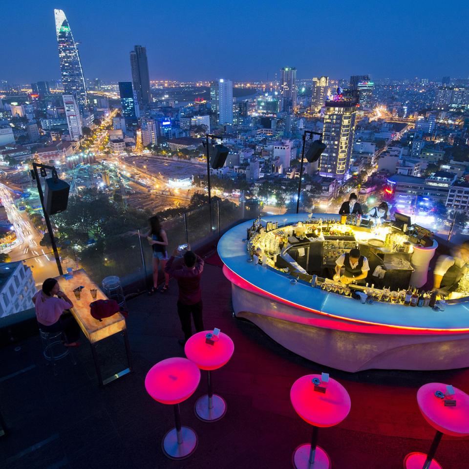 Ho Chi Minh City night skyline from a rooftop bar