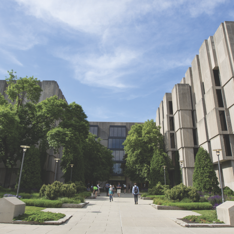 An exterior photograph of UChicago's brutalist Joseph Regenstein Library on a sunny day.
