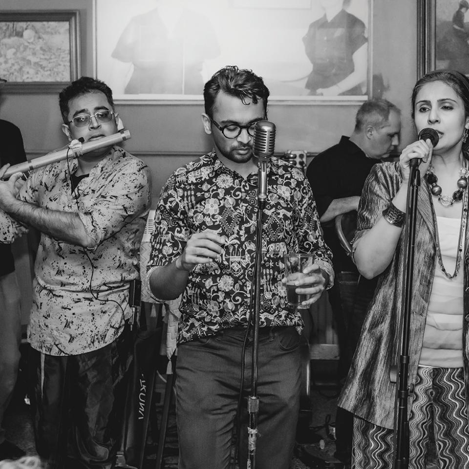 The band Do the Needful performing